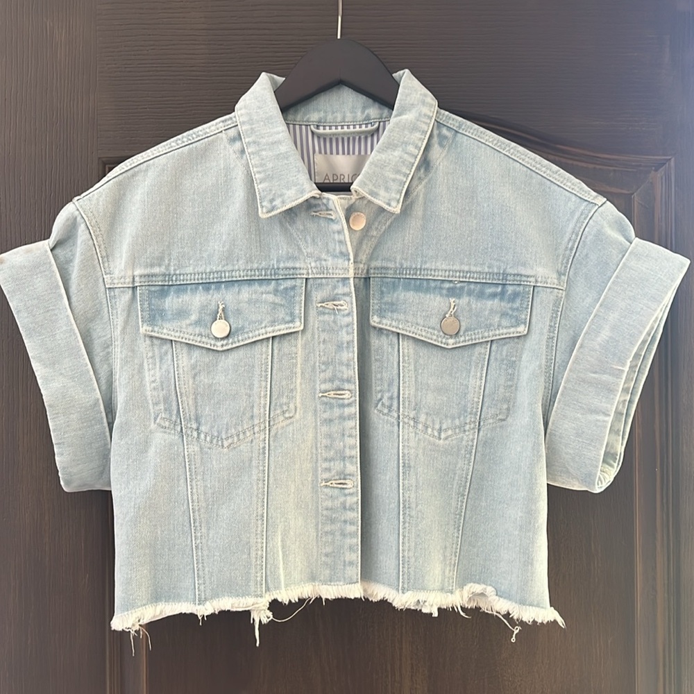 BNWT Oversize denim vest with bottom fringe, rolled sleeve.